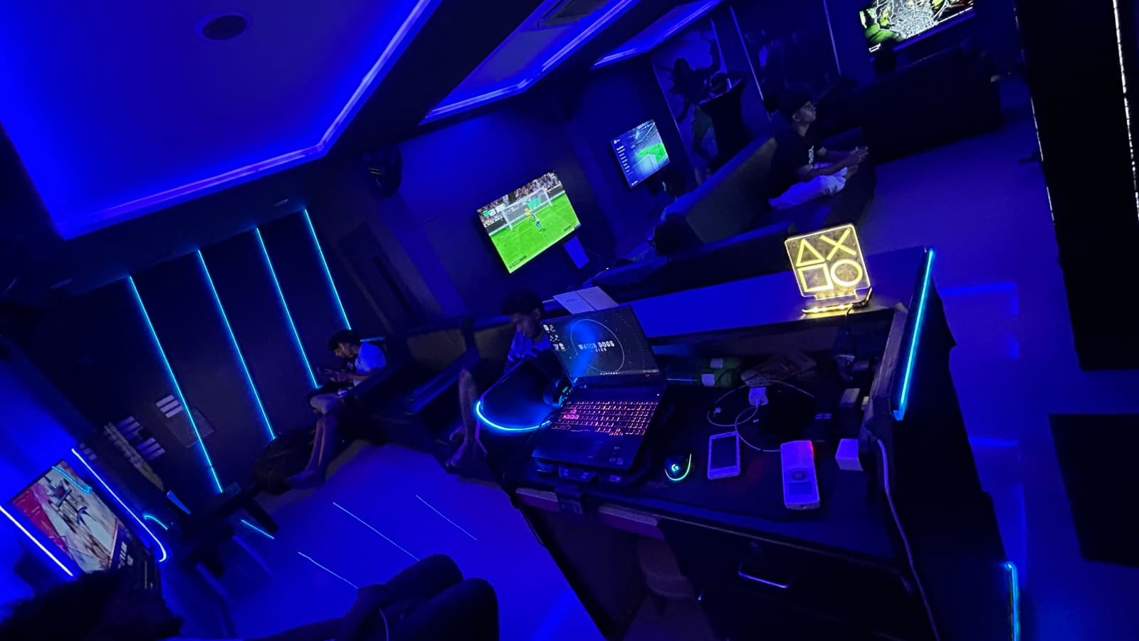 Friends playing together inside PS4 Gaming Lounge